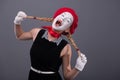 Portrait of female mime with white funny face