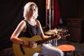 Portrait of female musician playing guitar Royalty Free Stock Photo