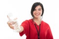 Portrait of female nurse making offering bottle of water