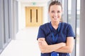 Portrait Of Female Nurse Standing In Hospital Corridor Royalty Free Stock Photo