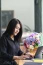 Portrait of female office worker concentrating on her work in office.