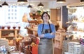 Portrait Of Smiling Female Owner Of Delicatessen Shop Wearing Apron Royalty Free Stock Photo