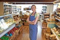 Portrait Of Female Owner Of Delicatessen Standing In Shop Royalty Free Stock Photo