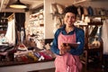 Portrait Of Female Owner Of Gift Store With Digital Tablet