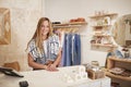 Portrait Of Female Owner Of Independent Clothing And Gift Store Behind Sales Desk Royalty Free Stock Photo