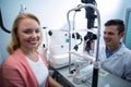 Portrait of female patient smiling in ophthalmology clinic Royalty Free Stock Photo