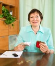 Portrait of female pensioner with cash and bills Royalty Free Stock Photo