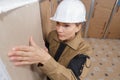 portrait female plasterer at work