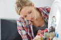 portrait female plumber working on boiler Royalty Free Stock Photo