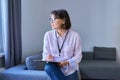 Portrait of female psychologist with clipboard sitting in office Royalty Free Stock Photo