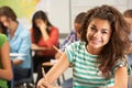 Portrait Of Female Pupil Studying At Desk In Classroom Royalty Free Stock Photo