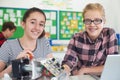 Portrait Of Female Pupils Studying Robotics In Science Lesson