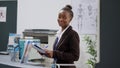 Portrait of female receptionist working at hospital reception counter Royalty Free Stock Photo