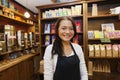 Portrait of female salesperson smiling in coffee shop