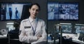 Portrait of female security officer in police monitoring center