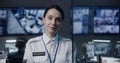 Portrait of female security worker looking at camera