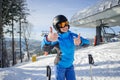 Portrait of female skier on the top of ski slope Royalty Free Stock Photo