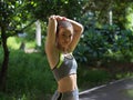 Portrait of female in sport ware cooling down after exercise in nature Royalty Free Stock Photo