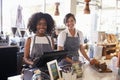 Portrait Of Female Staff Working At Delicatessen Checkout Royalty Free Stock Photo