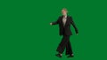 Portrait of female in suit on chroma key green screen. Blonde business woman in formal outfit walking.