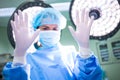 Portrait of female surgeon showing surgical gloves Royalty Free Stock Photo