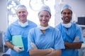 Portrait of female surgeon standing with arms crossed in operation room Royalty Free Stock Photo