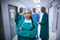 Portrait of female surgeon standing in corridor Royalty Free Stock Photo