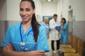 Portrait of female surgeon standing in corridor Royalty Free Stock Photo