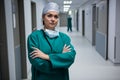 Portrait of female surgeon standing in corridor Royalty Free Stock Photo