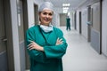 Portrait of female surgeon standing in corridor Royalty Free Stock Photo