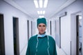 Portrait of female surgeon standing in corridor Royalty Free Stock Photo