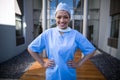 Portrait of female surgeon standing with hands on hip Royalty Free Stock Photo