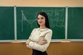 portrait female teacher or a student against blackboard and explain a lesson Royalty Free Stock Photo