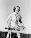 Portrait of female tennis player at the net