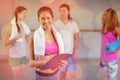 Portrait of female trainer holding clipboard Royalty Free Stock Photo