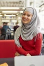 Portrait Of Female University Student Working In Library Royalty Free Stock Photo