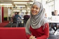 Portrait Of Female University Student Working In Library Royalty Free Stock Photo