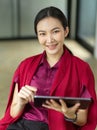 Portrait of female using portable tablet to check her schedule Royalty Free Stock Photo