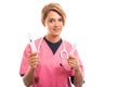 Portrait of female vet wearing pink scrub showing cannula