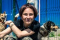 Portrait of a female volunteer at a dog shelter. Woman working in animal shelter. S Royalty Free Stock Photo