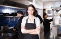 Portrait of female waiter who is standing with order on kitchen Royalty Free Stock Photo