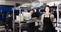 Portrait of female waiter standing with order Royalty Free Stock Photo