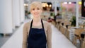 Portrait female worker in cafe. Mature 40s lady adult middle-aged woman pretty smiling waitress restaurant owner Royalty Free Stock Photo