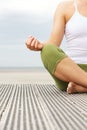 Portrait of female yoga hands at beach