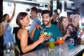 Portrait of females and males having fun in the bar Royalty Free Stock Photo