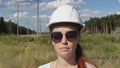 portrait of a feminized woman in a helmet.