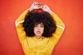 Portrait, fierce and black woman with attitude, power and empowerment with afro on studio background. Face, African