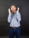 Portrait of fifty year old man showing emotions Royalty Free Stock Photo