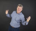 Portrait of fifty year old man showing emotions Royalty Free Stock Photo