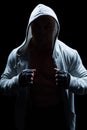 Portrait of fighter with hood and gloves Royalty Free Stock Photo